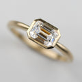 East-West Emerald-cut Bezel Solitaire Engagement Ring